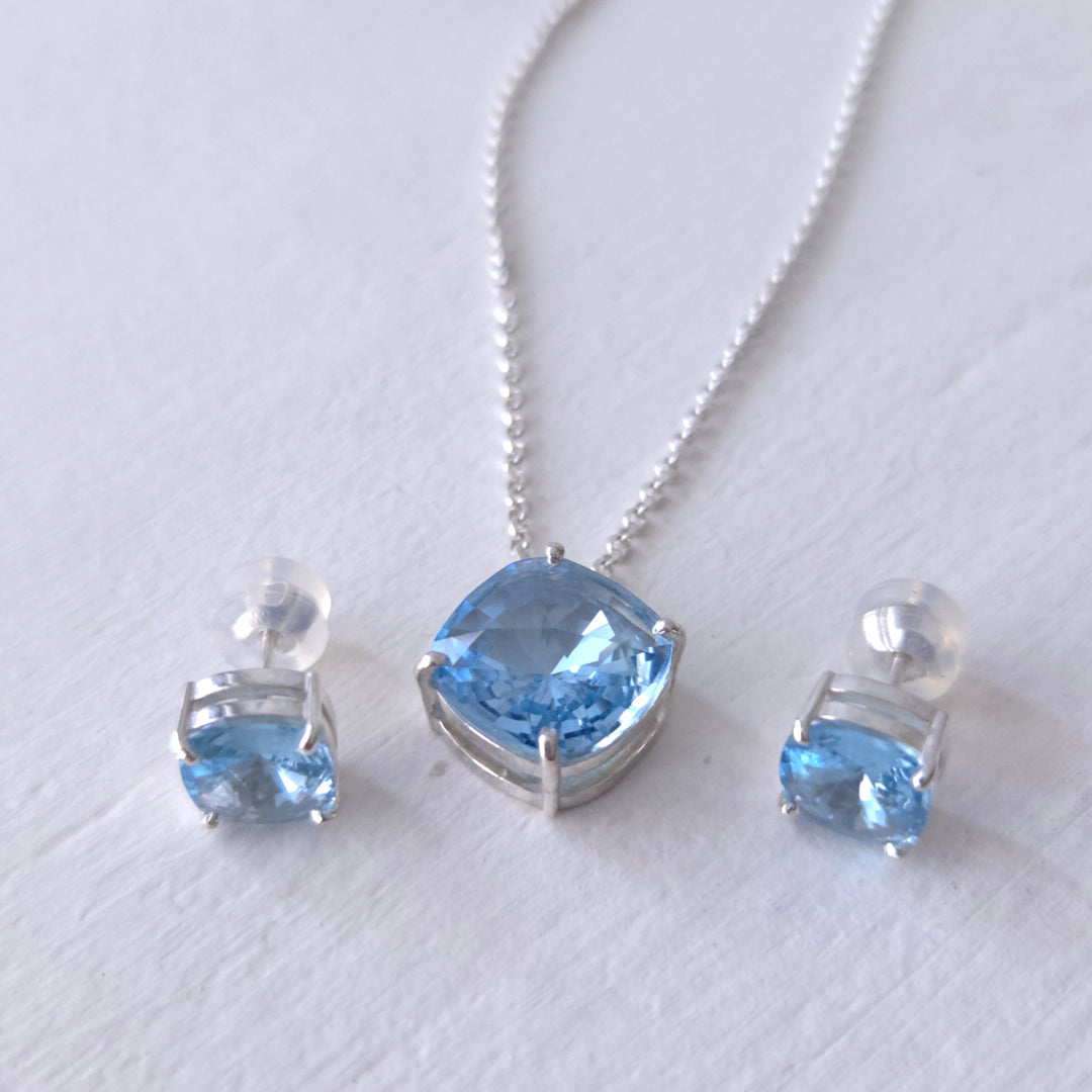 conjunto collar y pendientes plata 950 con cristal azul celeste